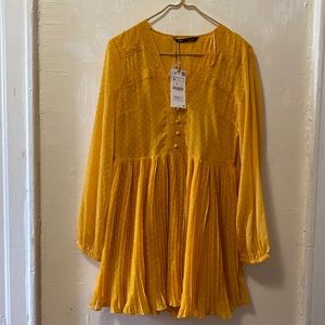 Mustardy color Dress. Float and bottom is pleated